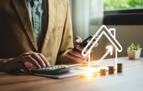 Imagem conceitual de negócios imobiliários, com gráfico de investimento e maquetes de propriedades residenciais, representando estratégias lucrativas de investimento imobiliário.